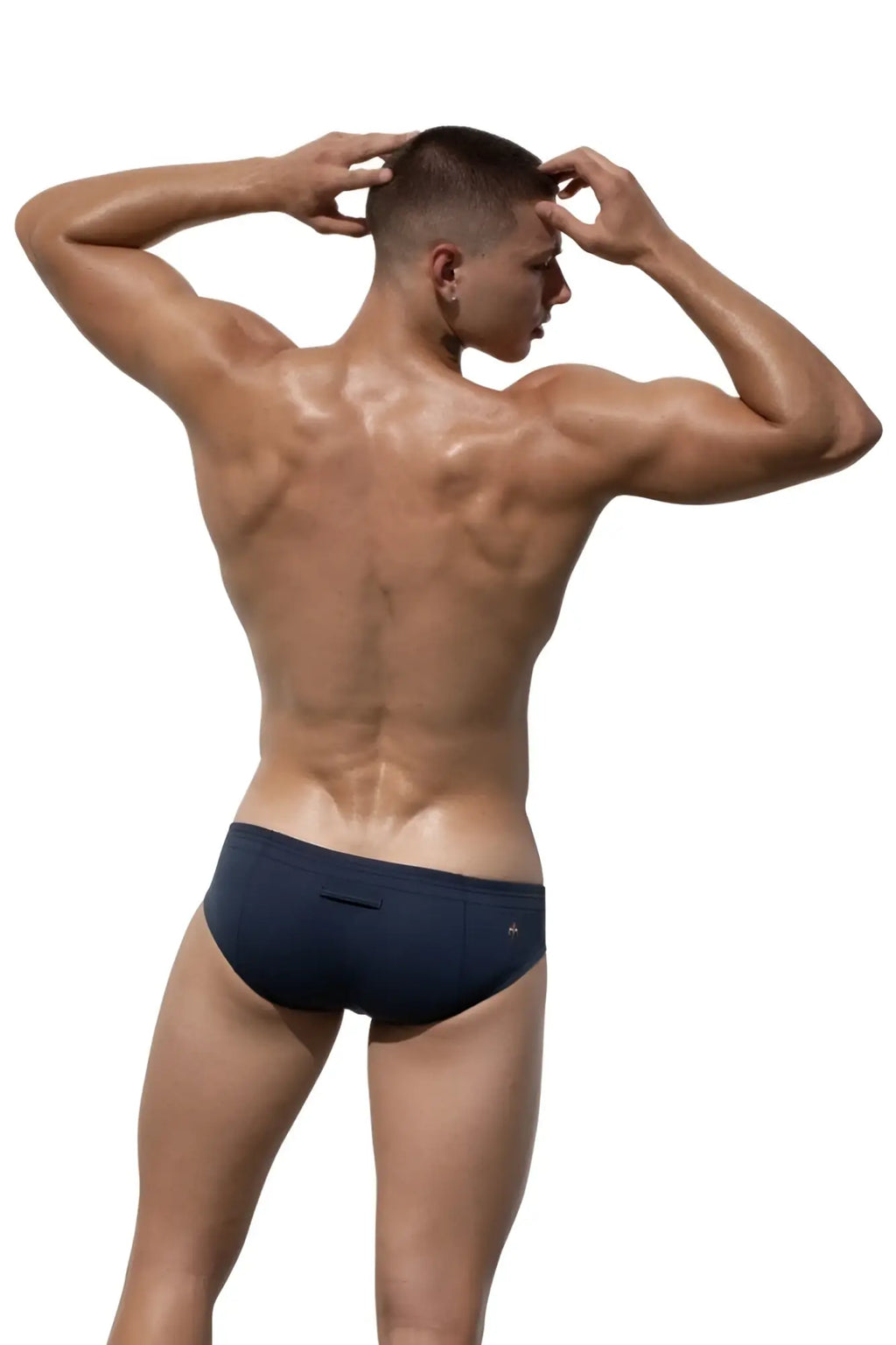 Dark blue marcuse waterboy brief underwear with a small logo on the waistband made for athletic use