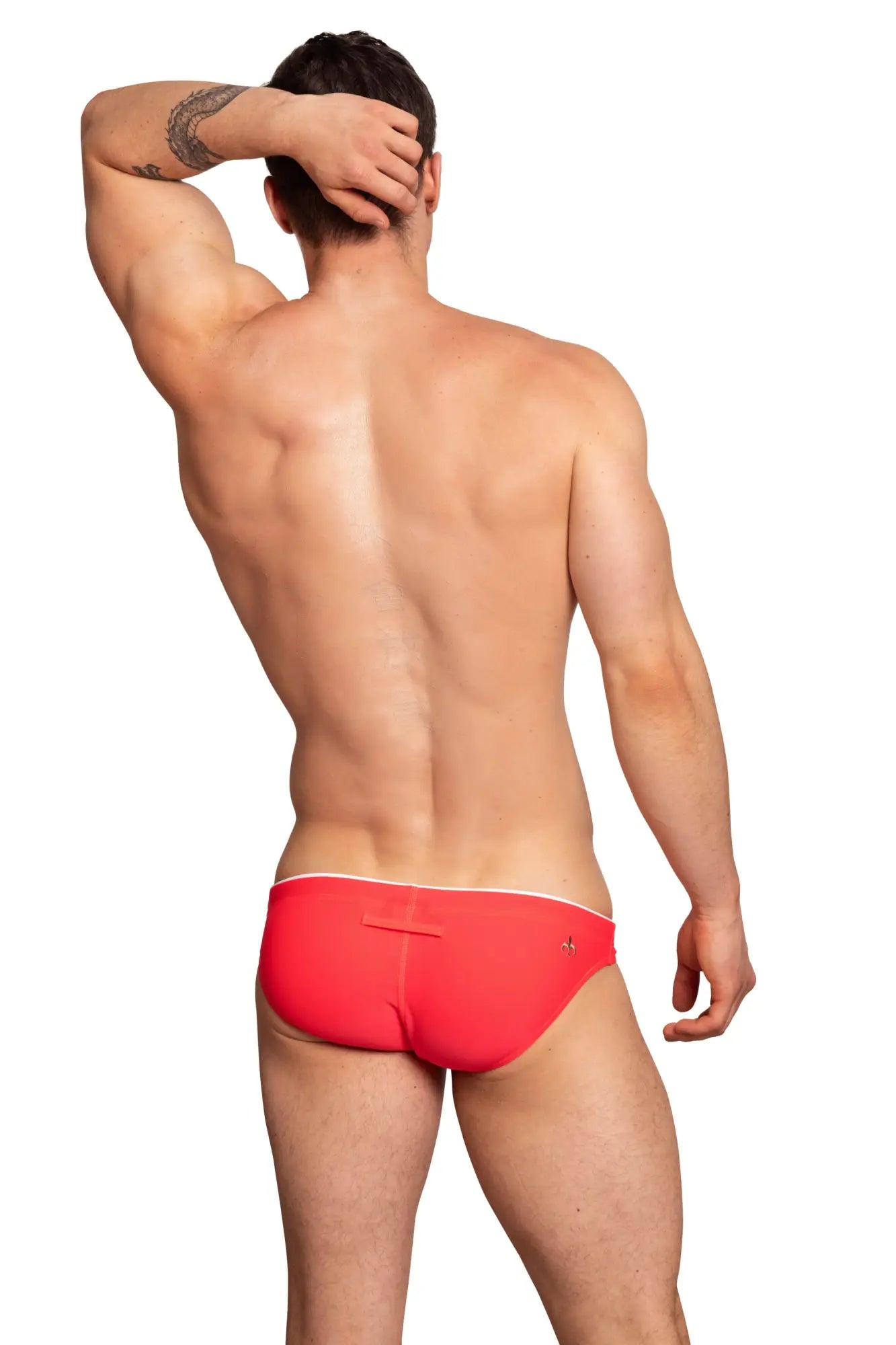 Back view of marcuse wonderland bikini swimwear bright red swim trunks with white trim and small logo on the back