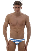 Marcuse yolo bikini swimwear blue and white striped swim trunks with a small red x emblem on the front