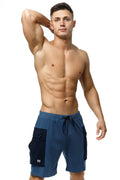 Marcuse Zaiden cargo shorts in navy blue with dark panels and a drawstring waistband for athletic use