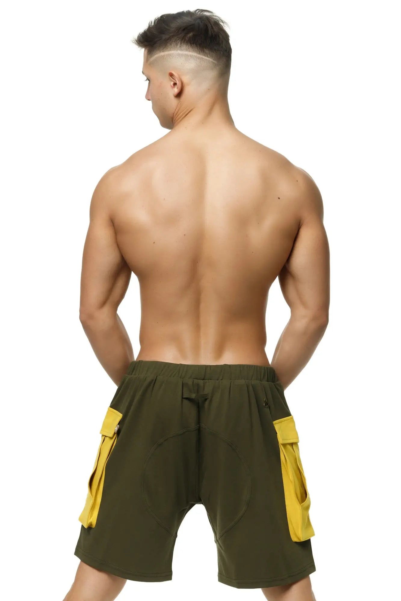 Marcuse Zaiden cargo shorts in olive green with bright yellow side pockets featuring a durable fabric design