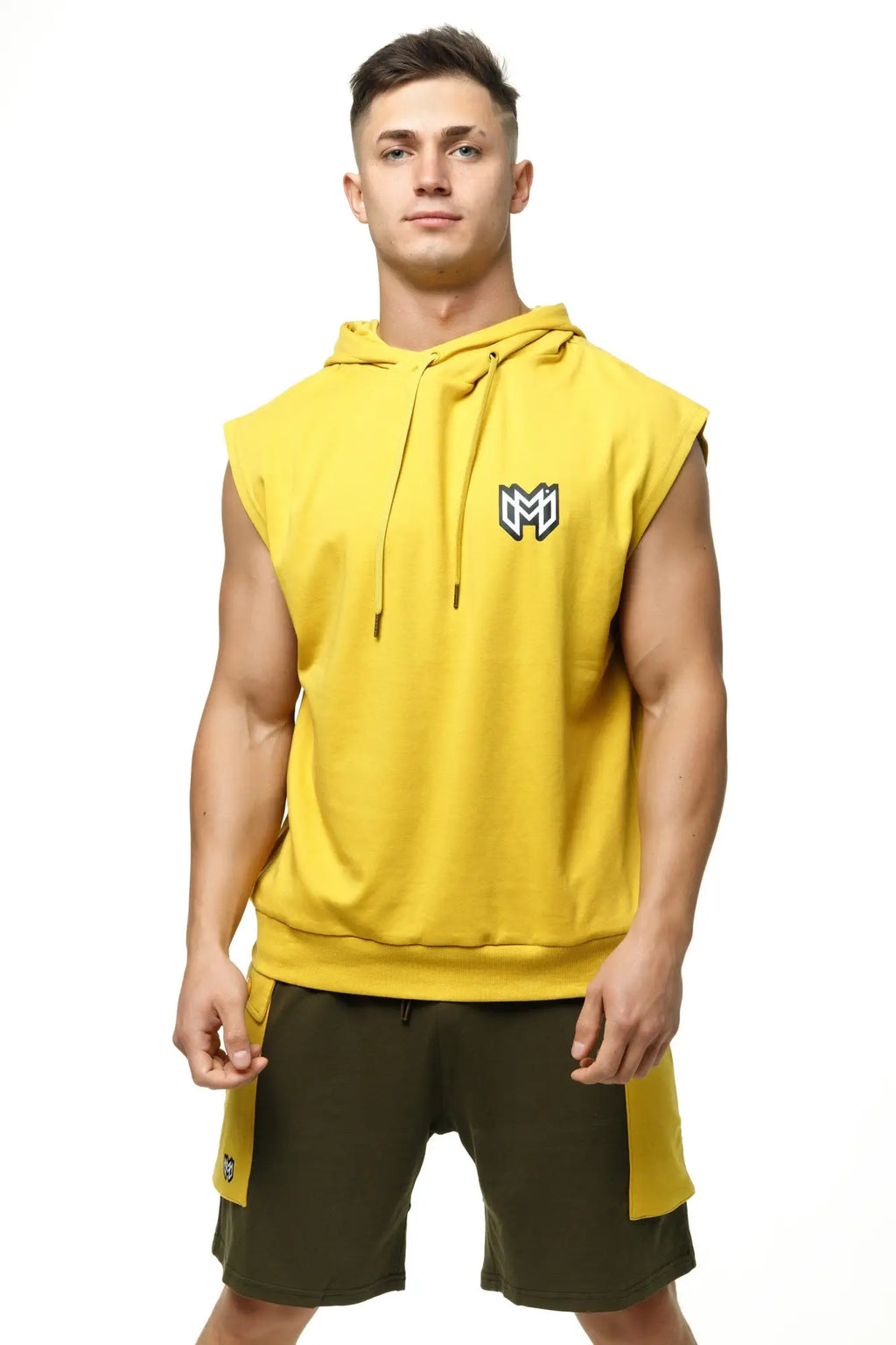 Bright yellow sleeveless hoodie tank top by marcuse zaiden with black and white logo on the chest perfect for casual wear