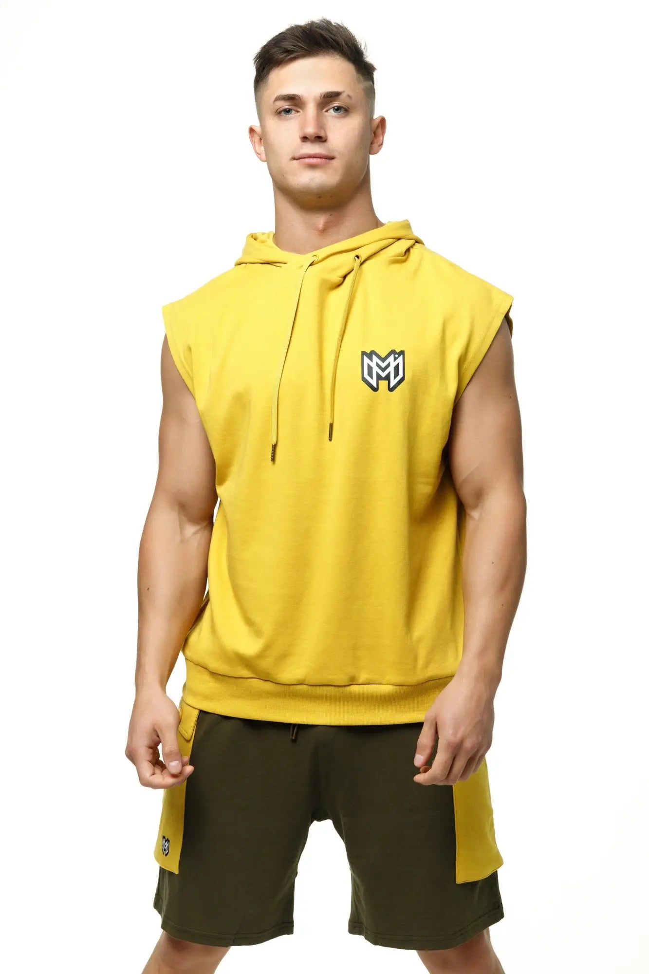 Bright yellow sleeveless hoodie tank top by marcuse zaiden with black and white logo on the chest perfect for casual wear