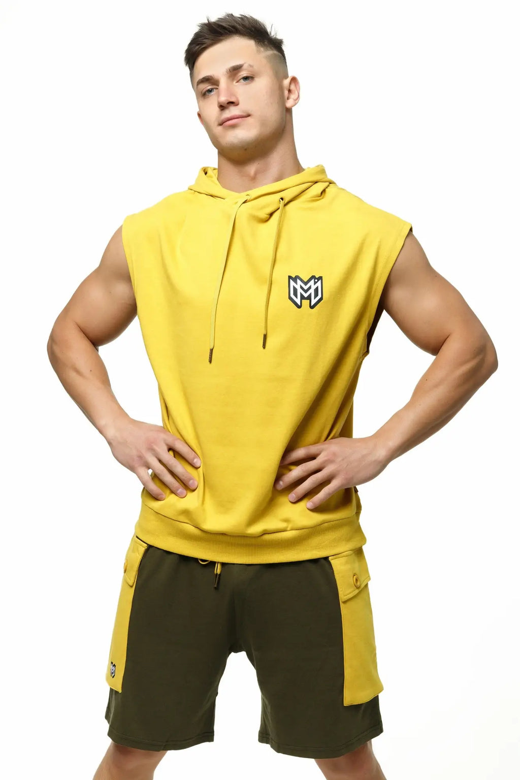 Bright yellow marcuse zaiden sleeveless hoodie tank top with black and white logo on the chest in soft fabric