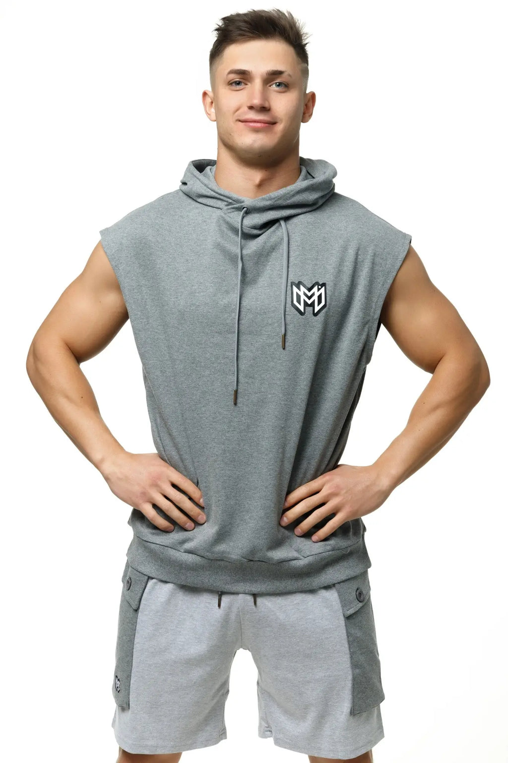 Gray marcuse zaiden sleeveless hoodie tank top with drawstring hood and black and white logo on the chest