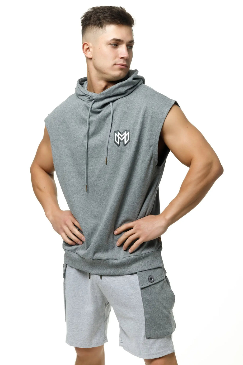 Marcuse Zaiden gray sleeveless hoodie tank top with drawstring hood and small white logo on the chest