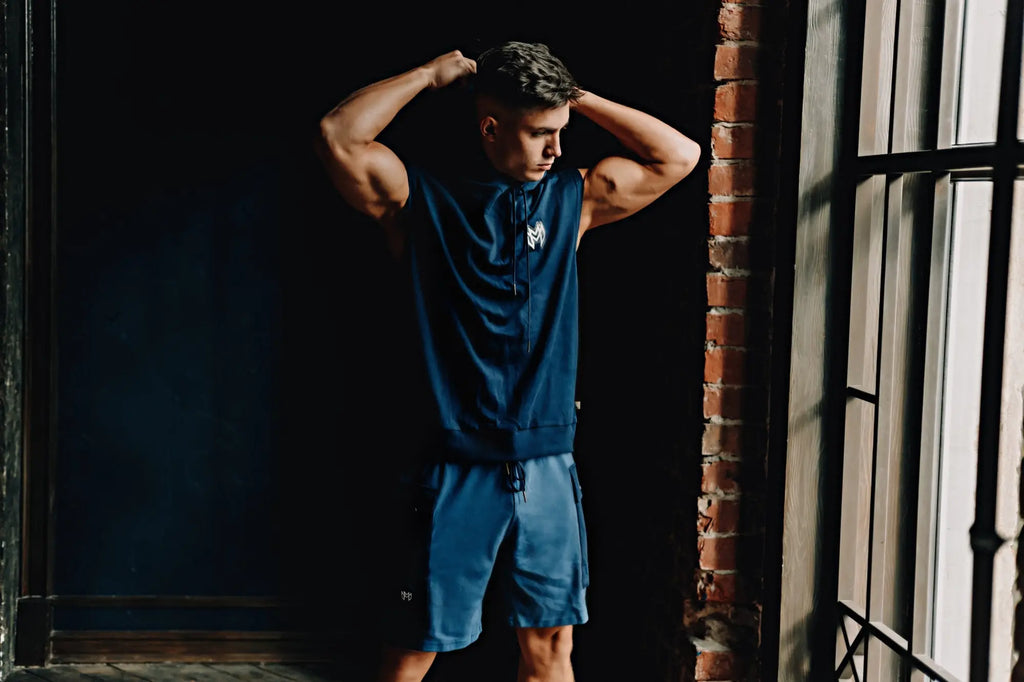 Marcuse Zaiden navy blue sleeveless zip-up hoodie tank top with small white logo on the chest