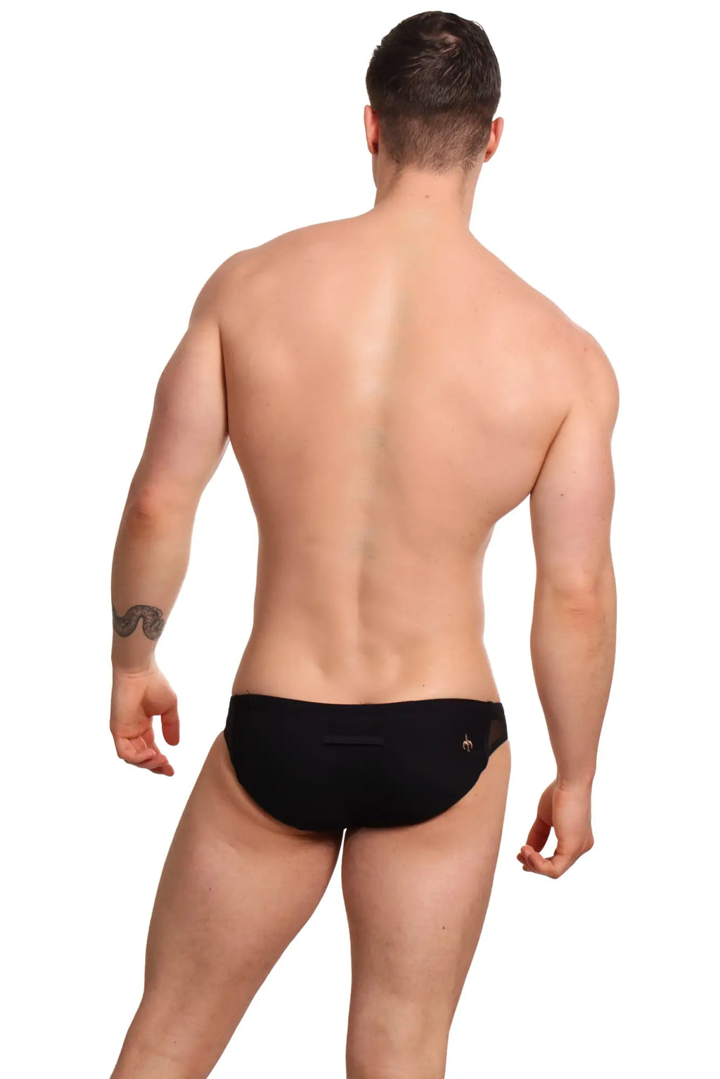 Black calvin klein swim trunks with subtle logo on waistband part of marcuse zenith bikini swimwear collection