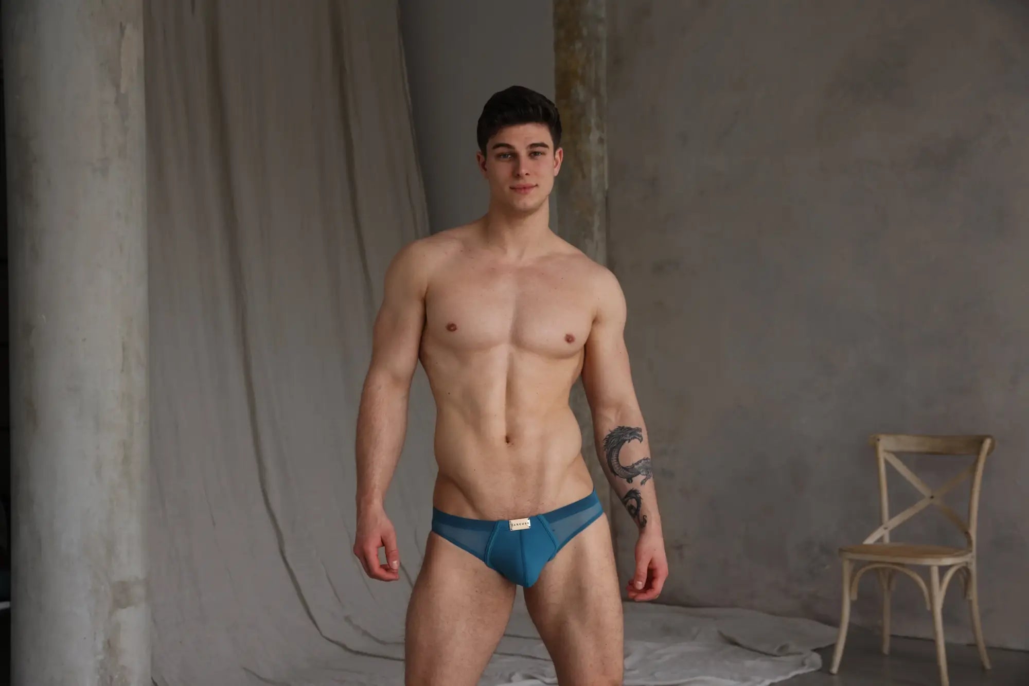 Marcuse Zenith bikini swimwear blue mesh briefs with a small white label at the front