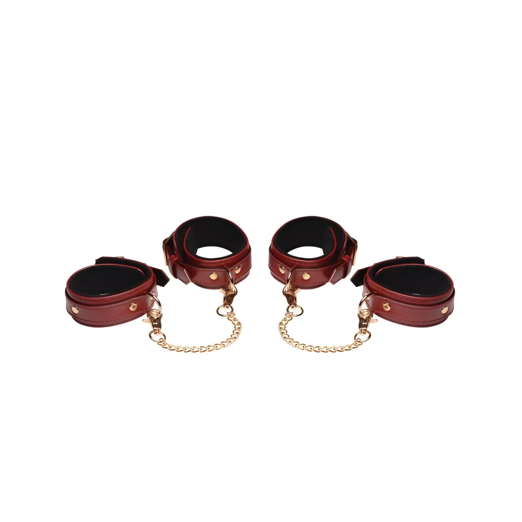 Set of four burgundy pu leather cuffs with gold-tone chains and hardware from master series bondage set