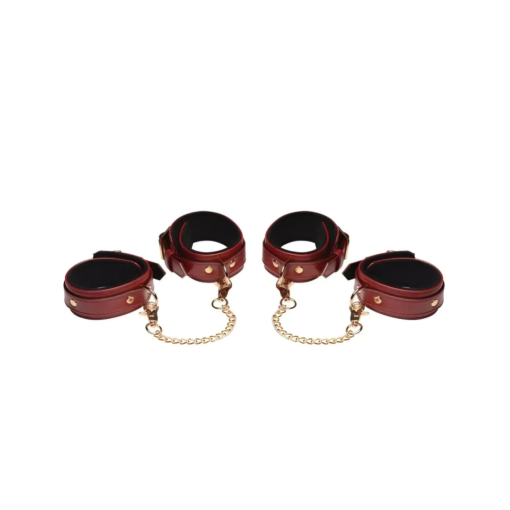 Set of four burgundy pu leather cuffs with gold-tone chains and hardware from master series bondage set
