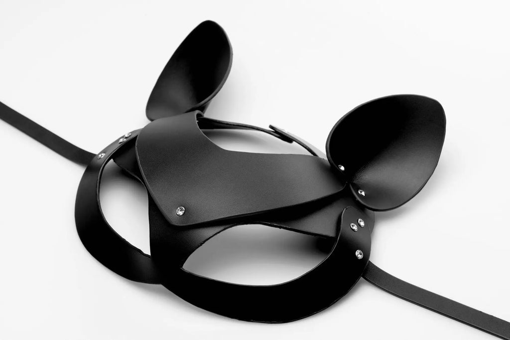 Master series bad kitten leather cat mask in black with shiny silver rivets and adjustable straps shown from back side