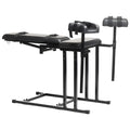 Black leather-bound master series extreme obedience chair with adjustable metal frame and padded seating for restraint