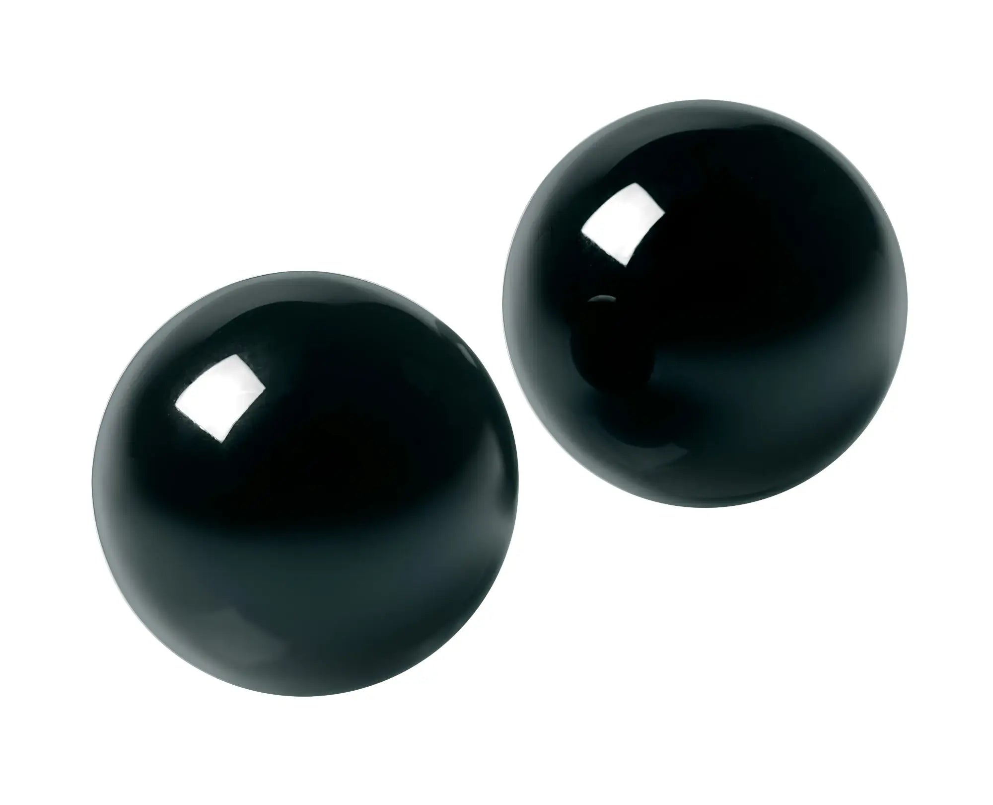 Two glossy black spherical ben wa balls made of jaded glass with a smooth polished finish from master series 30mm