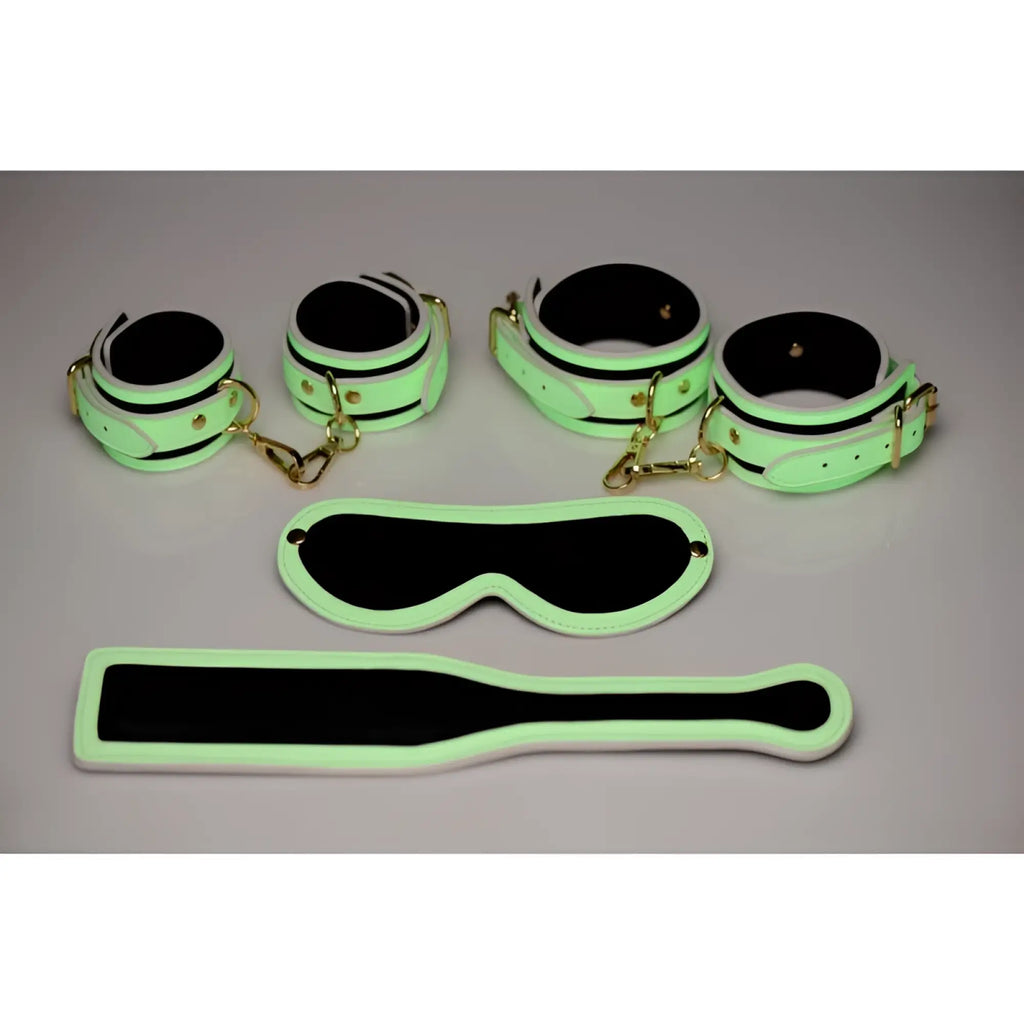 Luminous green and black glow-in-the-dark bdsm playset with gold-toned hardware from the Master Series kink in the dark set