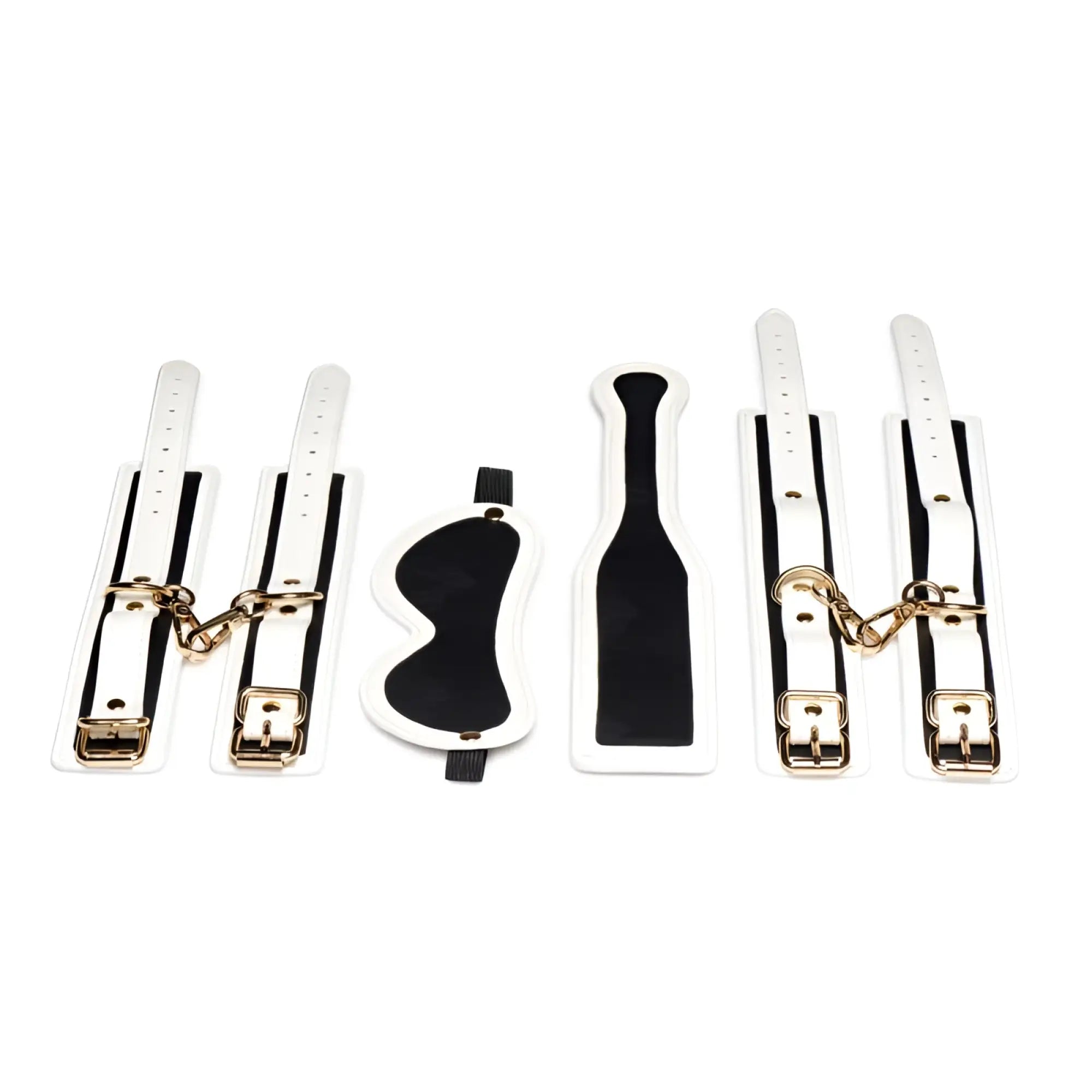 White and black leather bondage set with gold-tone hardware from master series kink in the dark glowing fluro green