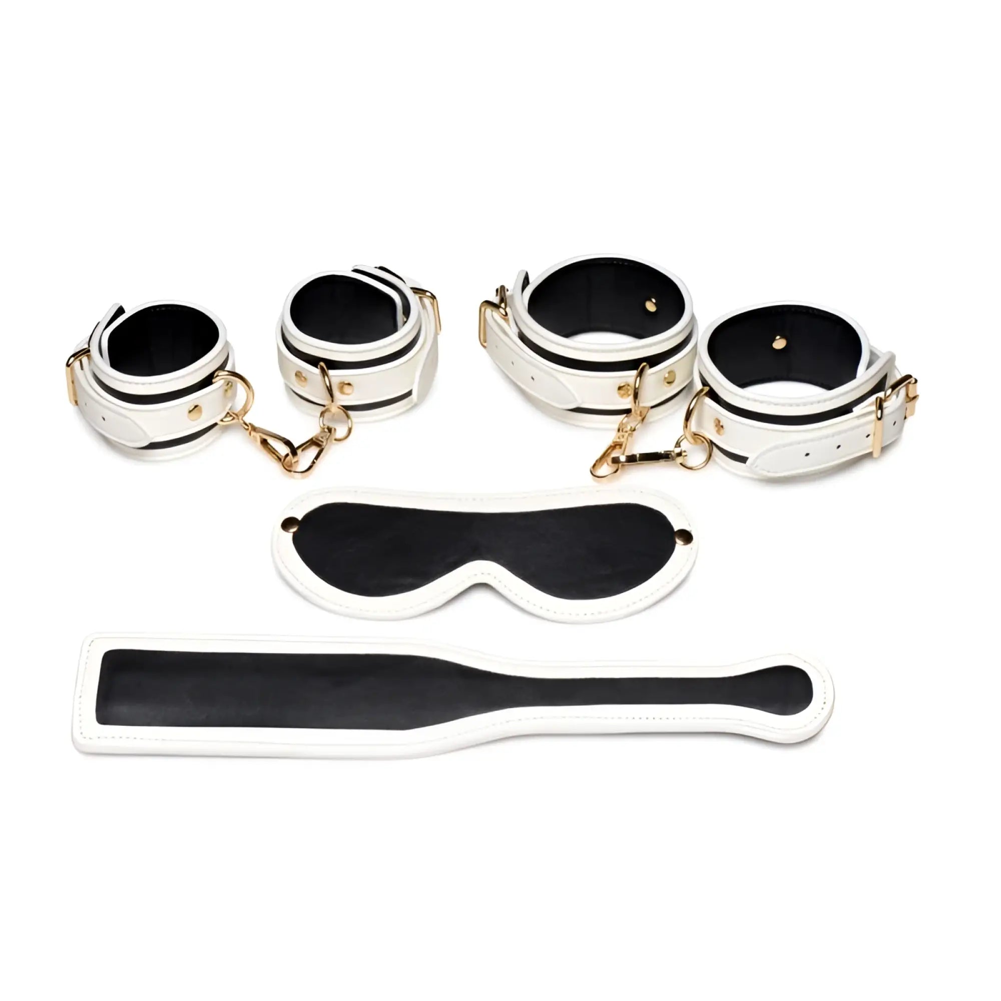 White leather bondage set with black accents and gold-tone hardware from master series kink in the dark glowing fluro green collection