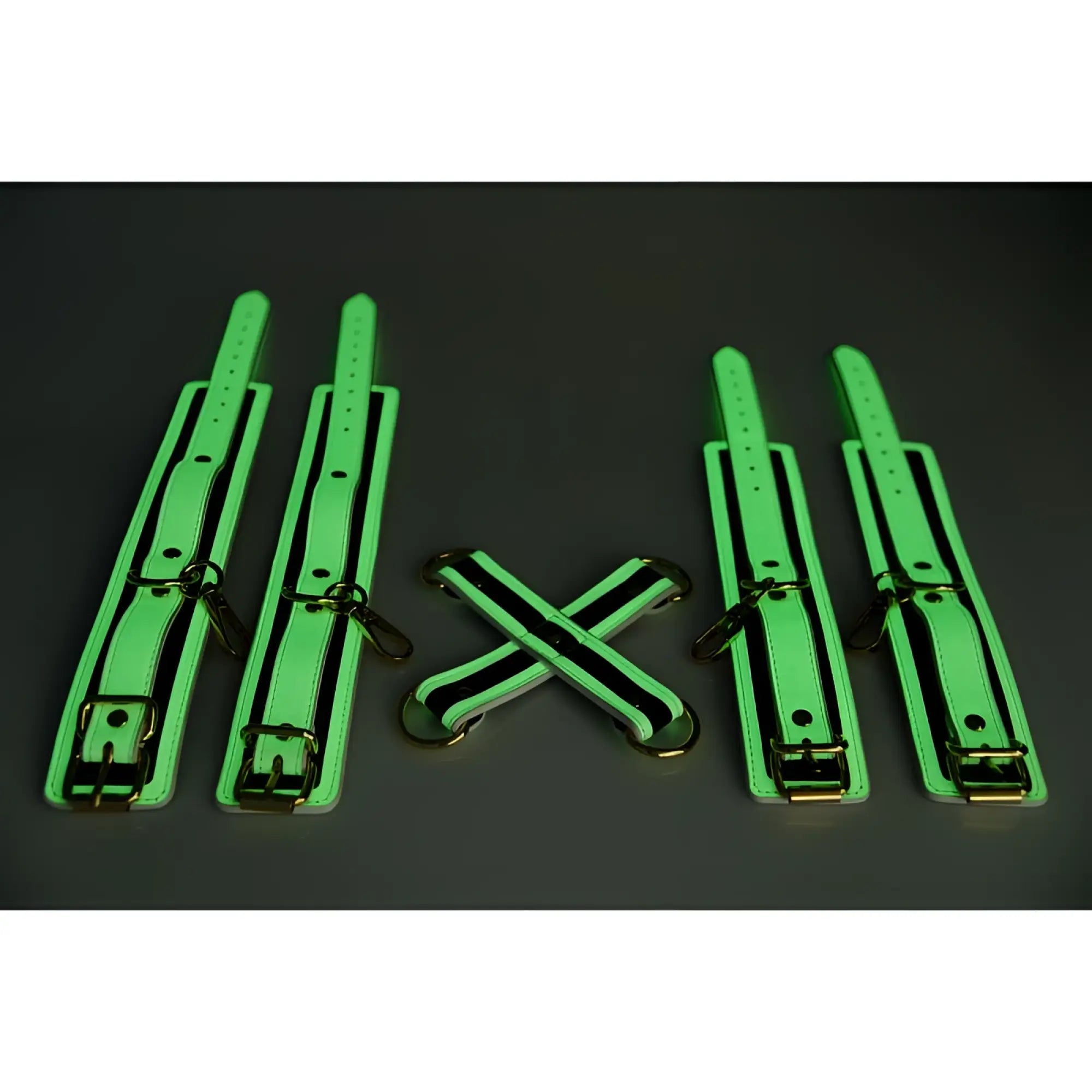 Set of four neon green glow-in-the-dark leather cuffs with black trim and gold metal hardware for hog tie use