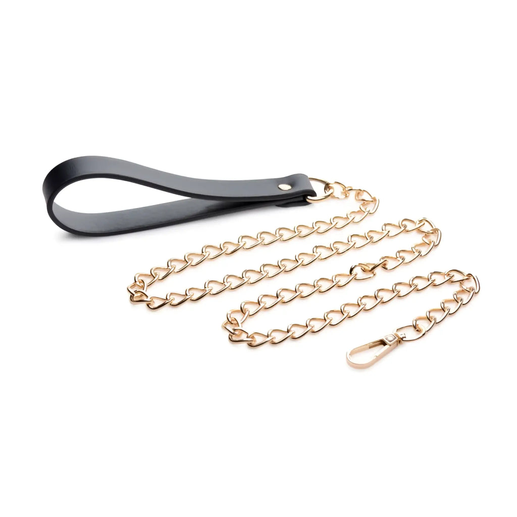 Black leather handle attached to a gold-toned heart-shaped chain leash with matching clasp in master series leashed lover