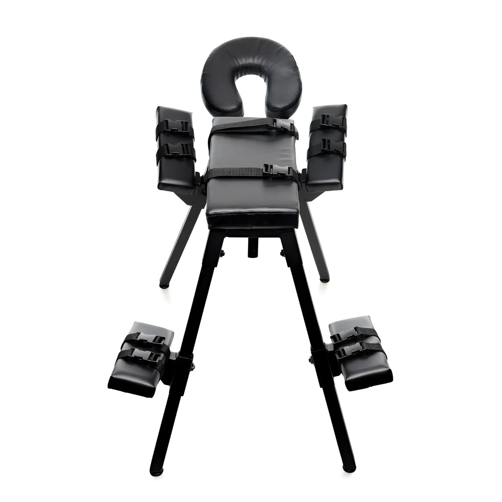 Black padded restraint chair with adjustable arm and leg straps from master series obedience extreme sex bench