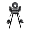 Black padded restraint chair with adjustable arm and leg straps from master series obedience extreme sex bench