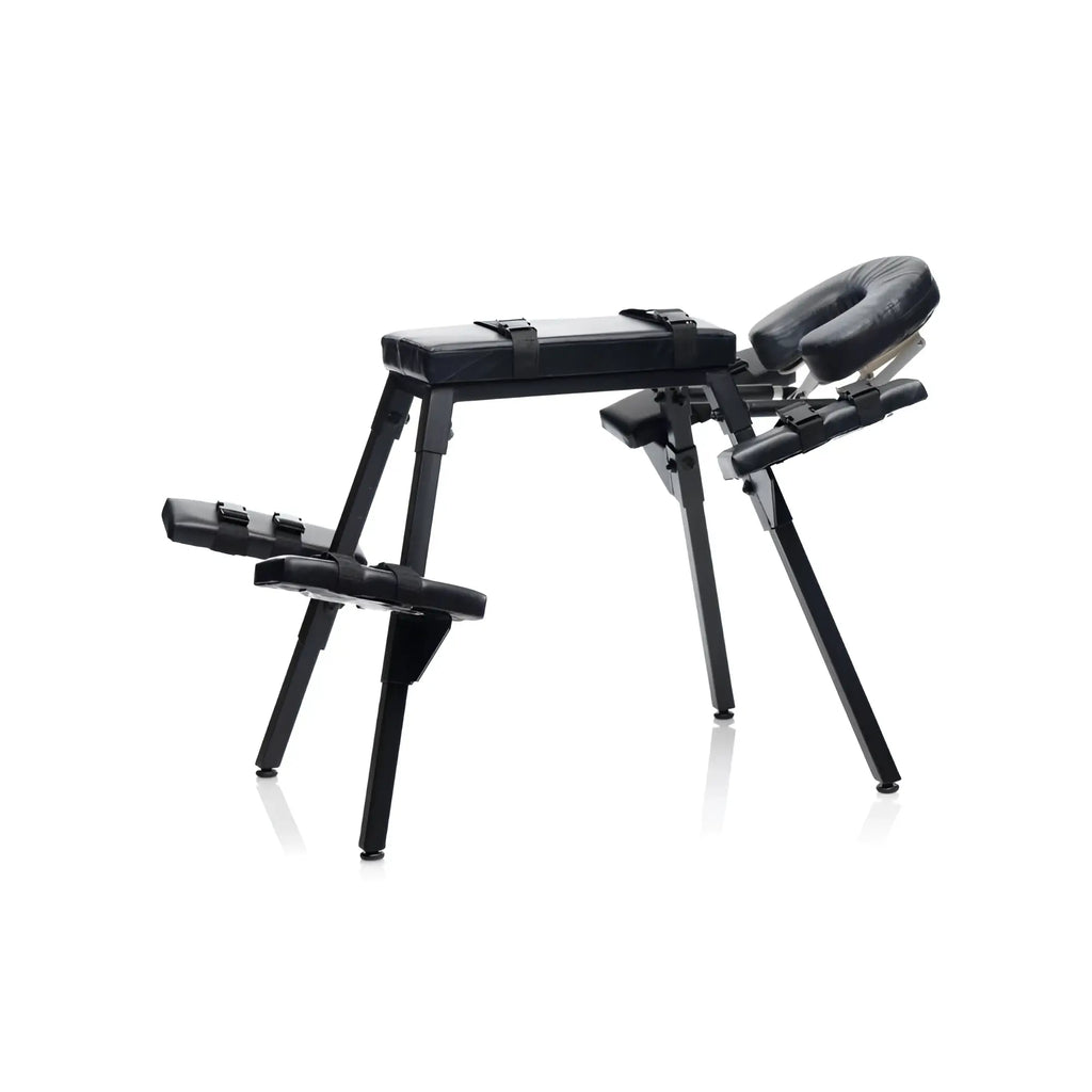 Black padded massage table with adjustable headrest footrest sturdy metal frame and restraint straps master series obedience bench