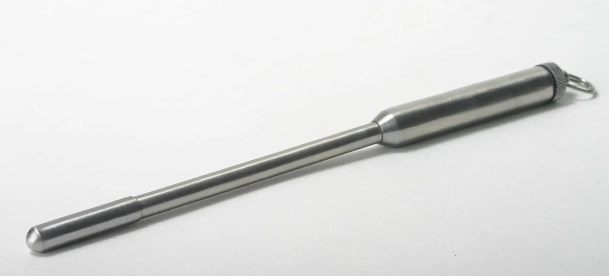 Silver metallic pen-style keychain with textured grip and rounded ends from master series power exchange medium vibrating sound