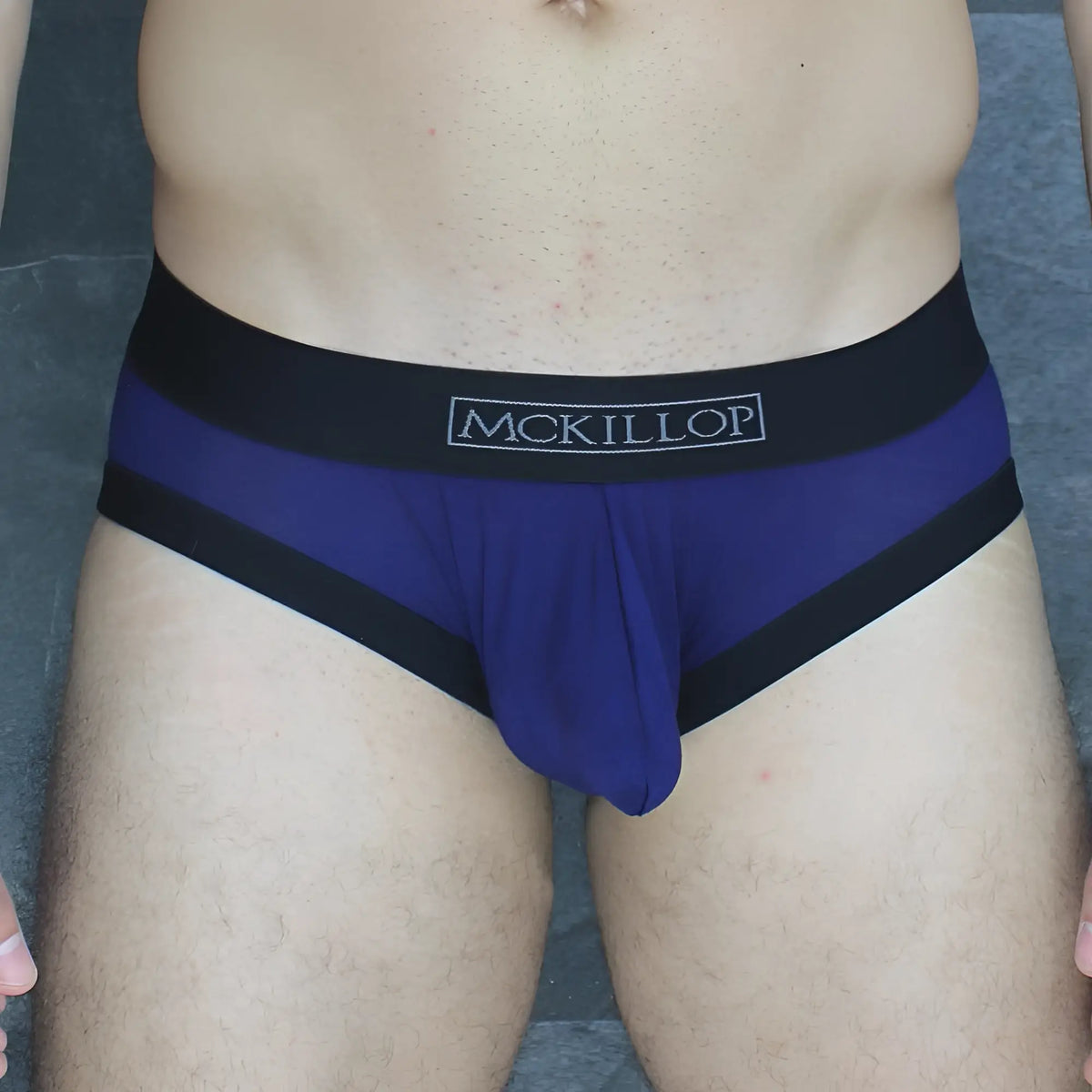 Purple and black mckillop obmo hoist brief modal with solid purple body and contrasting black waistband and leg bands
