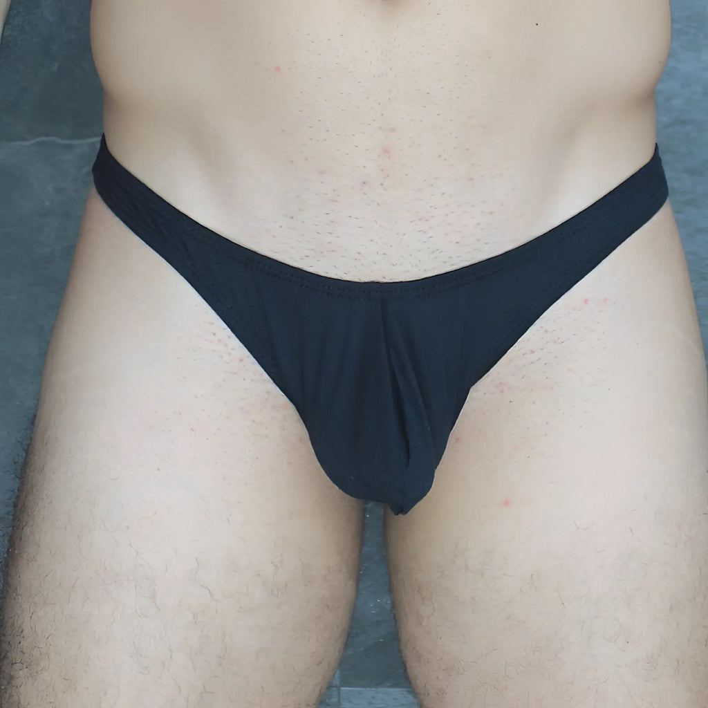 Black form-fitting thong made of smooth modal fabric shown from the back in mckillop vtmo hoist thong modal product image