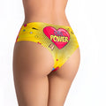 Bright yellow bikini bottom with bold pink heart and girl power lettering from mememe lingerie comics strong girl slip s