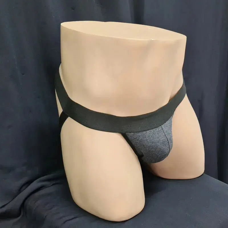 Black and dark grey jockstrap underwear by Arroyman featuring a soft fabric pouch and wide elastic waistband.