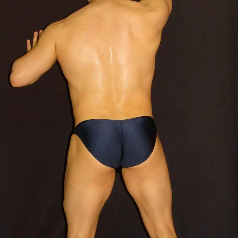 Navy men's bikini underwear by Arroyman featuring a snug fit and smooth fabric shown from the back on a model.
