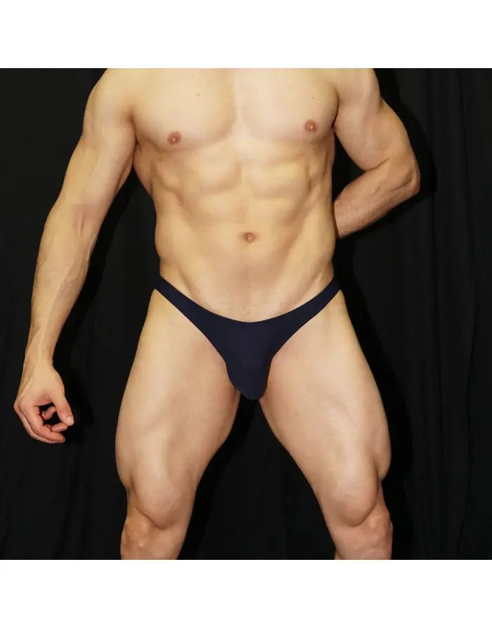 Navy men's bikini underwear by Arroyman featuring a snug fit and minimal coverage shown on a model.