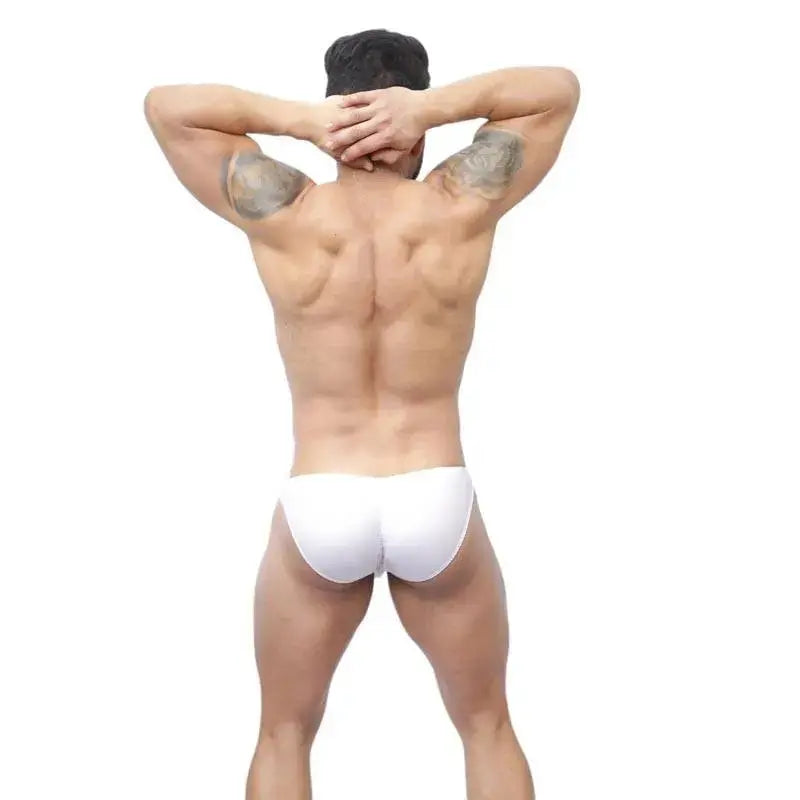 Men's white bikini underwear by Arroyman featuring a snug fit and minimal coverage shown from the back on a model.