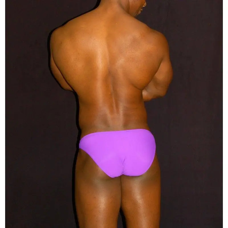 Men's purple bikini underwear by Arroyman featuring a smooth fitted design shown from the back on a model.