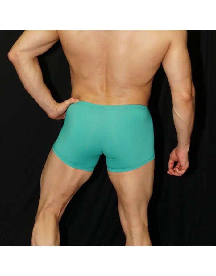 Turquoise men's boxer underwear by Arroyman featuring a snug fit and smooth fabric shown from the back on a model.
