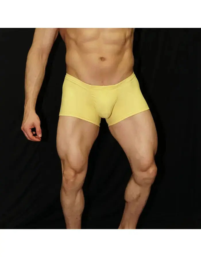 Men's yellow boxer underwear by Arroyman featuring a snug fit and soft material shown on a model against a black background.