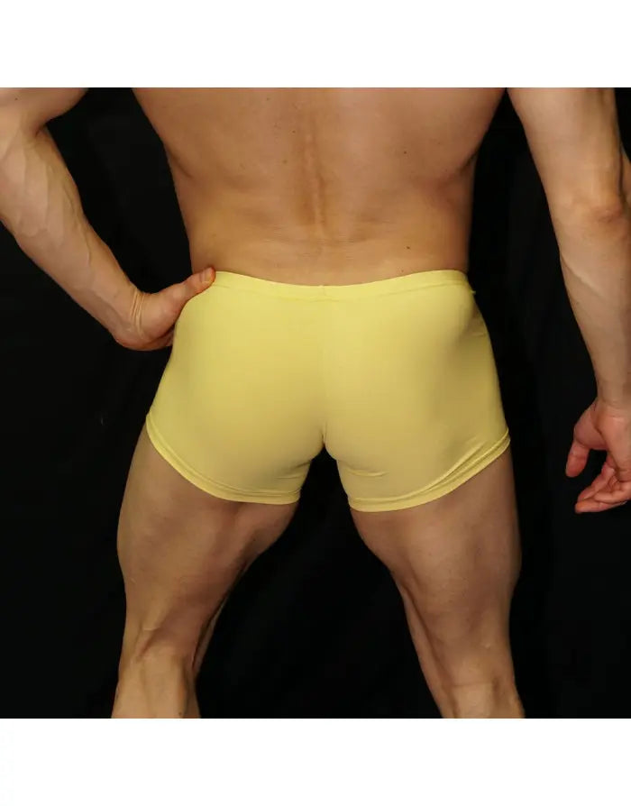 Men's yellow boxer underwear by Arroyman featuring a snug fit and soft material shown from the back on a model.