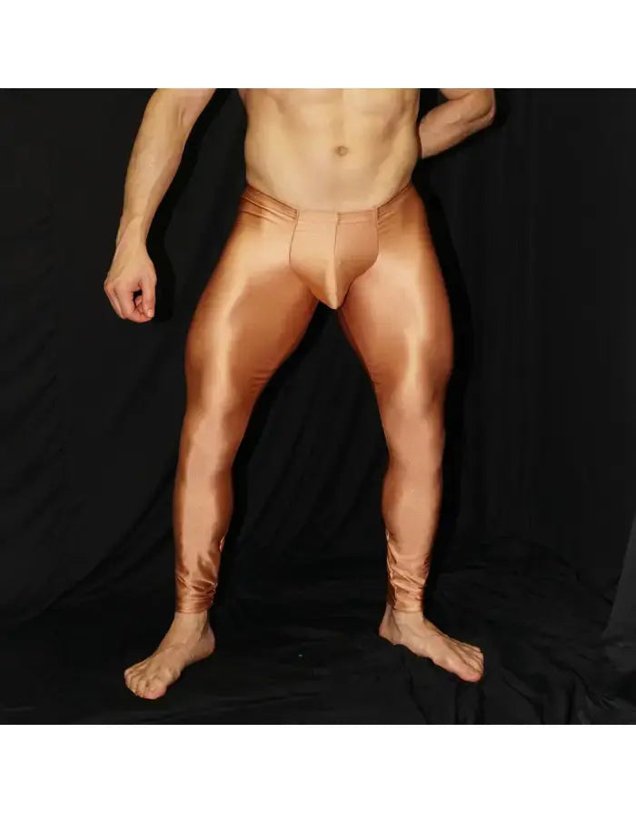 Men's copper-colored tights by Arroyman featuring a bulge design and a smooth shiny finish shown on a model.