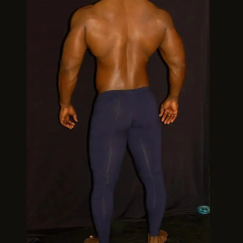 Navy spandex fitness tights by Arroyman featuring a snug fit and smooth texture shown from the back on a model.