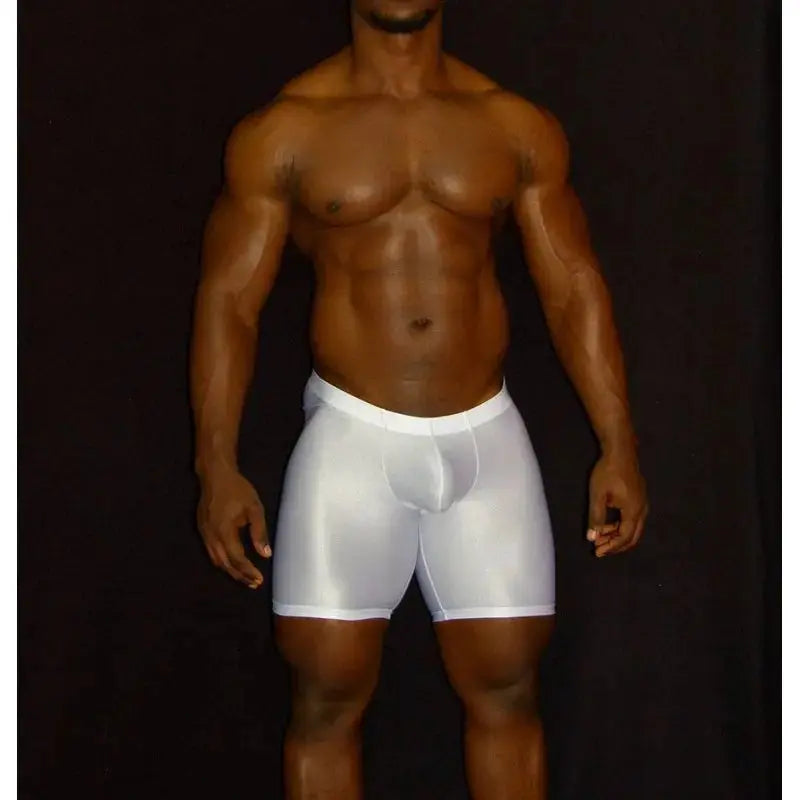 White compression shorts on a model featuring a snug fit and smooth fabric by Arroyman.