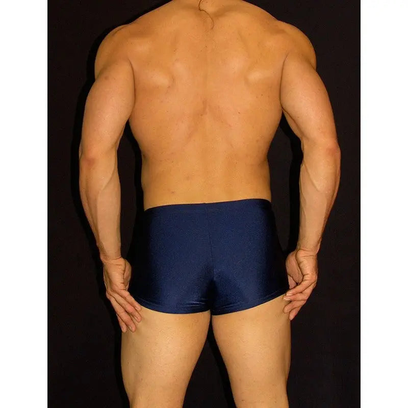 Navy square cut boxer swimwear by Arroyman featuring a smooth fitted design shown from the back on a model.
