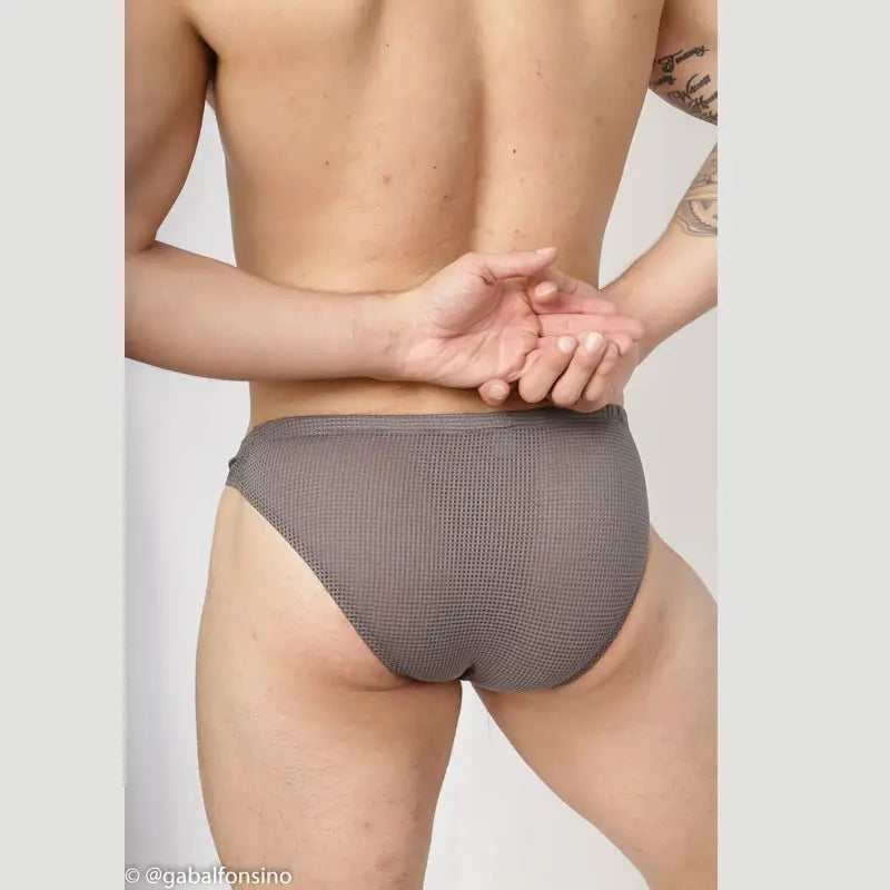 Men's grey mesh bikini underwear by Arroyman featuring a snug fit and breathable fabric shown from the back.