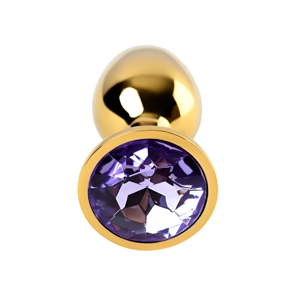 Gold-toned metal anal plug featuring a small faceted amethyst crystal in its center for elegant use