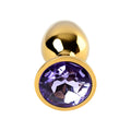 Gold-toned metal anal plug featuring a small faceted amethyst crystal in its center for elegant use