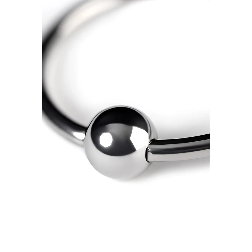 A sleek polished silver metal penis head ring 30mm featuring a smooth spherical bead at its center