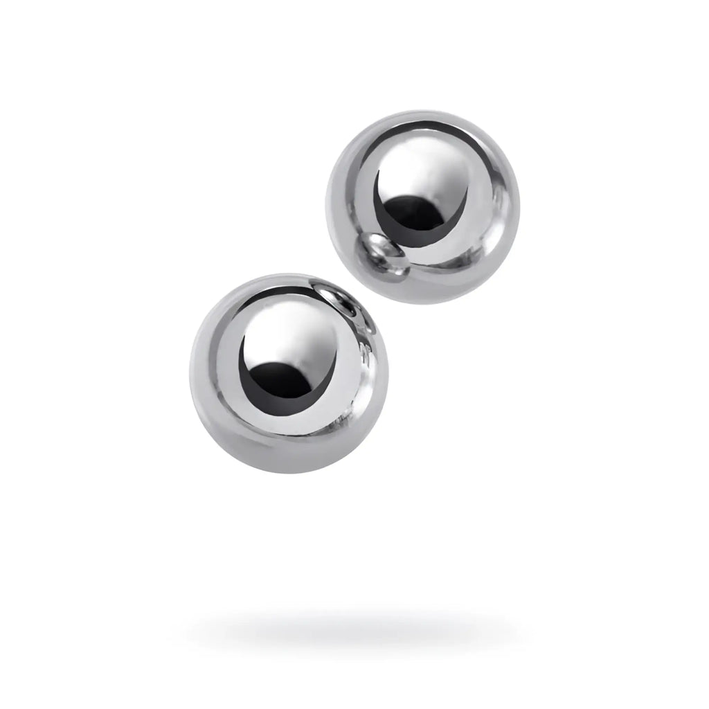 Two polished chrome silver metal vaginal balls with smooth reflective surface and 25mm spherical shape