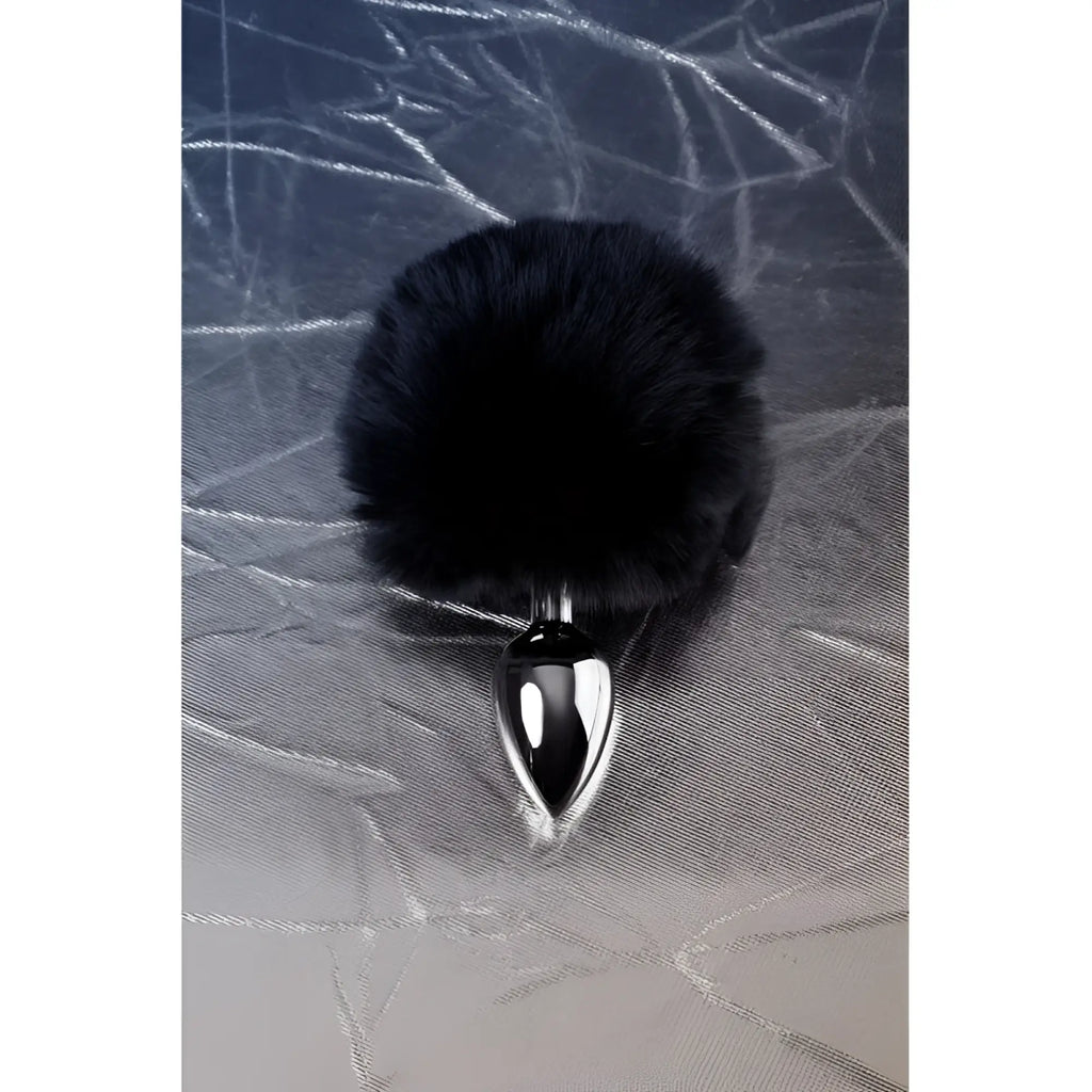 Black faux fur covered small metal anal plug with sleek silver polished base for discreet intimate use