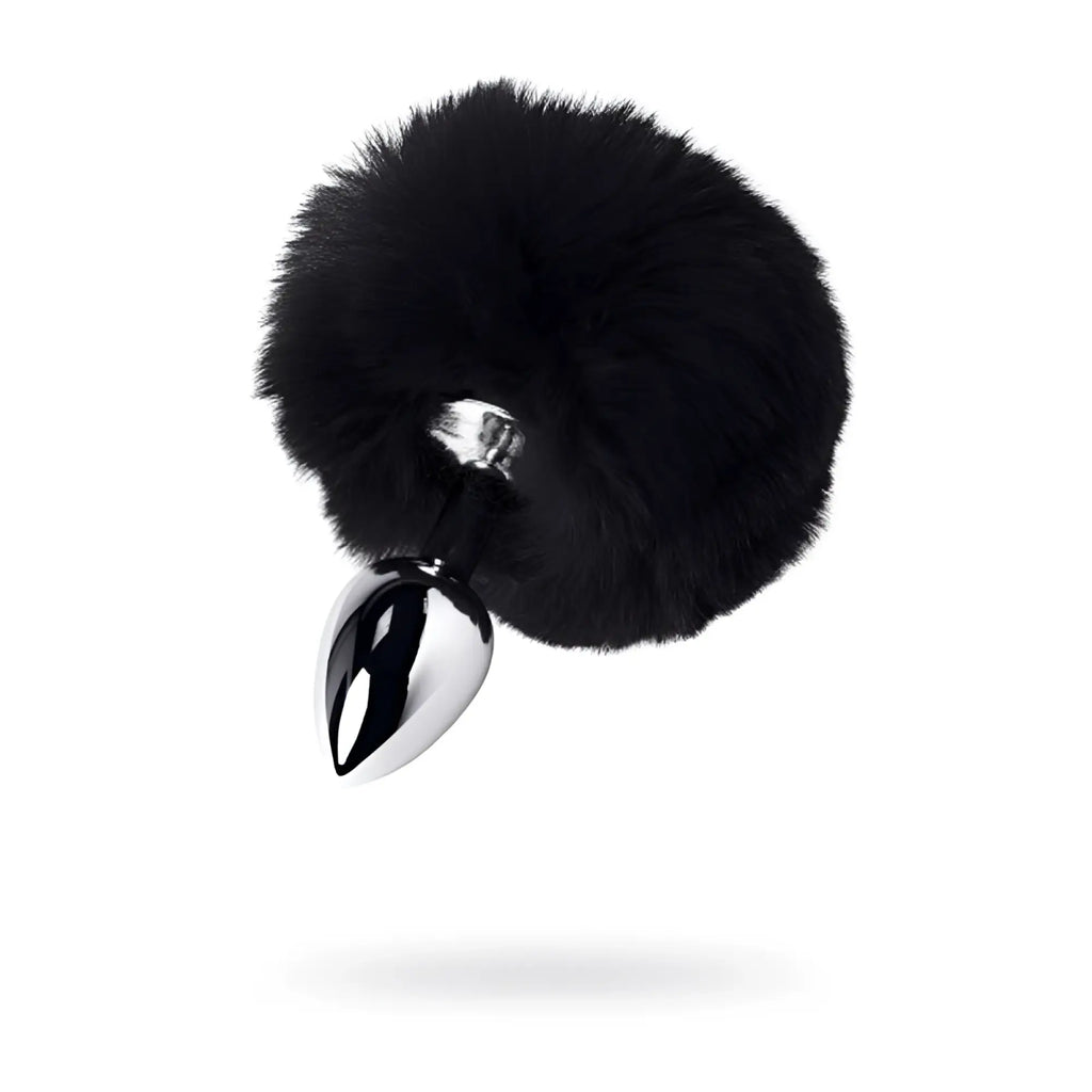 Black faux fur covered small metal anal plug with polished chrome tip and black tail for intimate use
