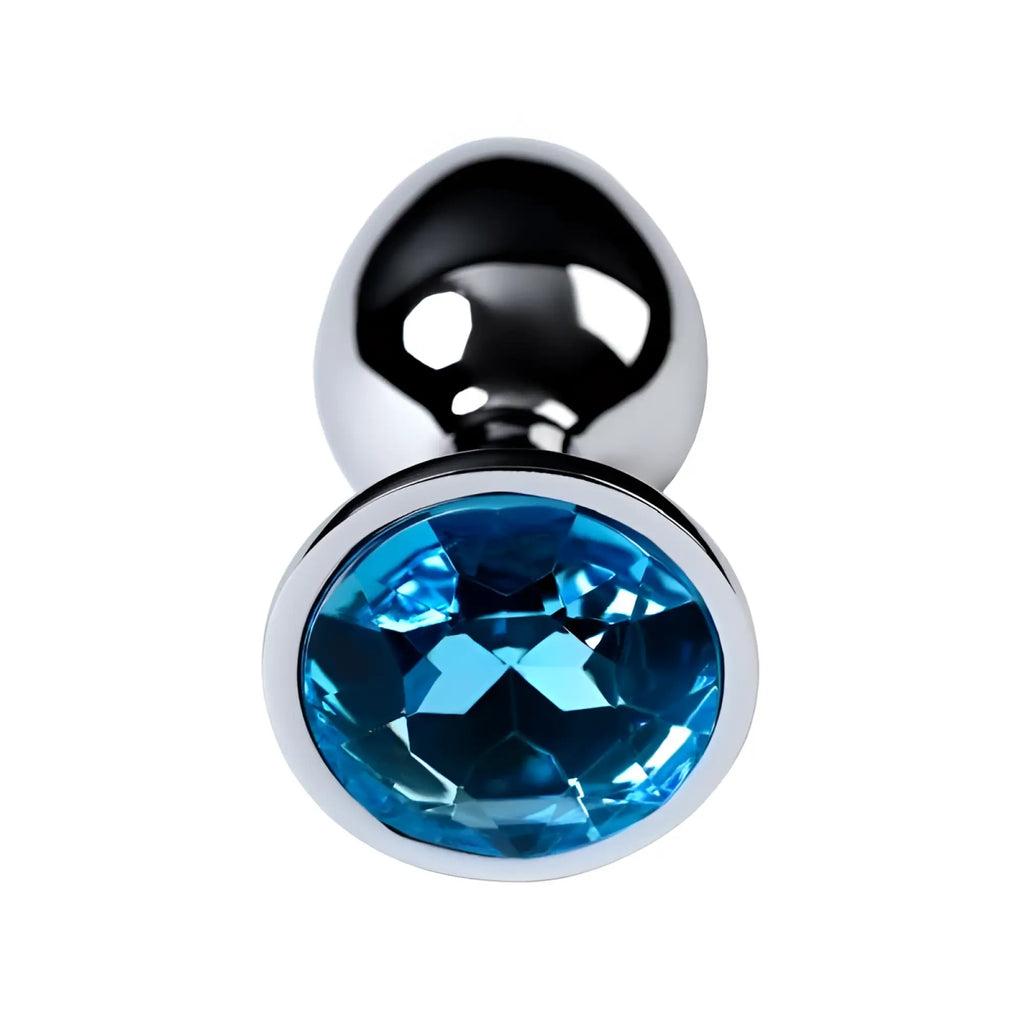 A sleek chrome finished small metal silver anal plug with a prominent oval cut blue topaz crystal center
